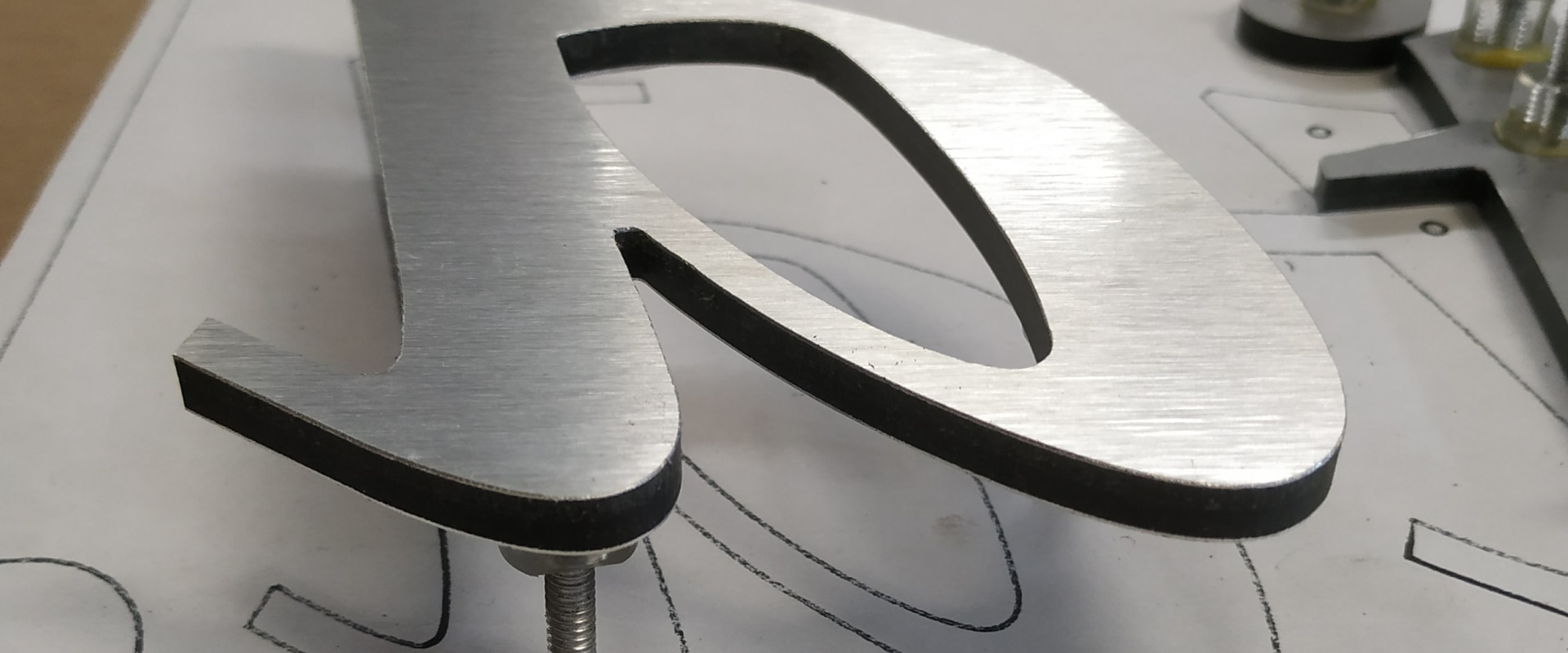 A Complete Guide to Hanging Installations for Custom Signs and Printing Services